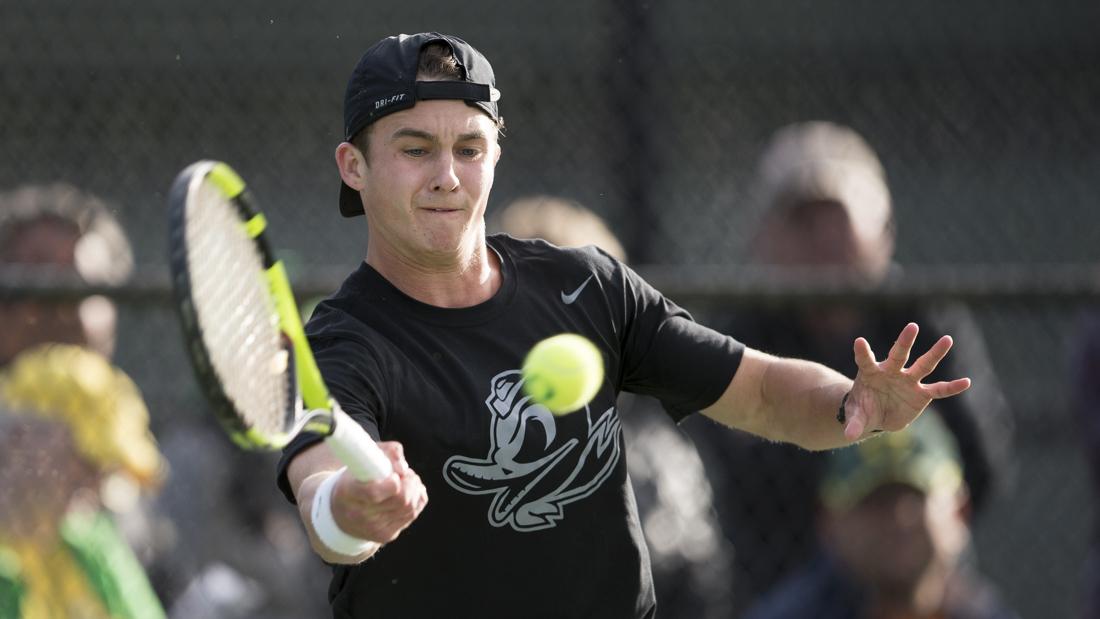 Cormac Clissold returns a serve to his opponent during his singles match. The No. 22 Oregon Ducks play the No. 41 Washington Huskies at the Oregon Student Tennis Center in Eugene, Ore. on Saturday, April 22, 2017. (Adam Eberhardt/Emerald)