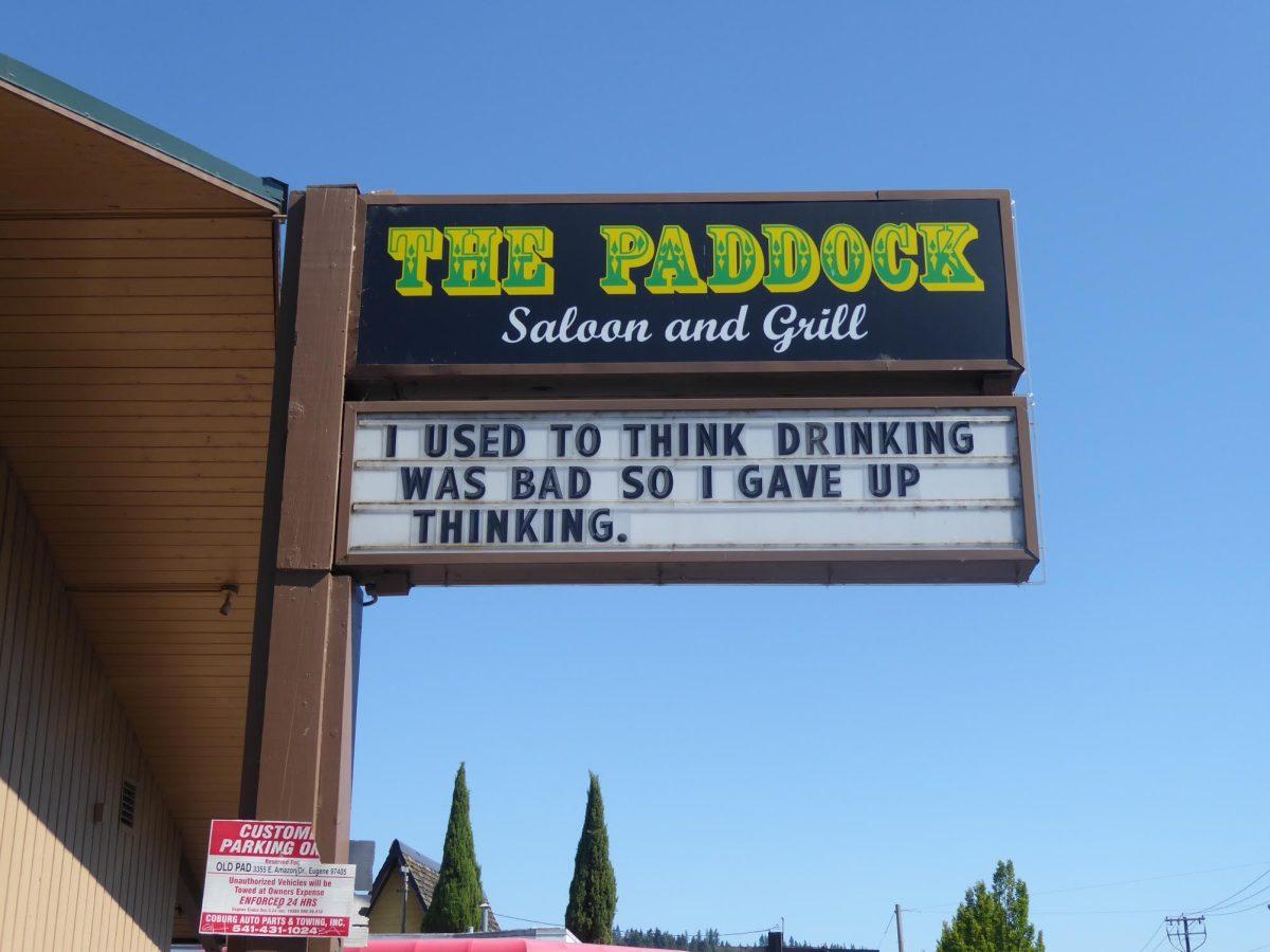 The Old Pad&#8217;s outdoor billboard retains the original name of the bar. The owner, LaMonte Cherrick, says he enjoys coming up with new slogans for the marquee. (Julia Taylor/Emerald)