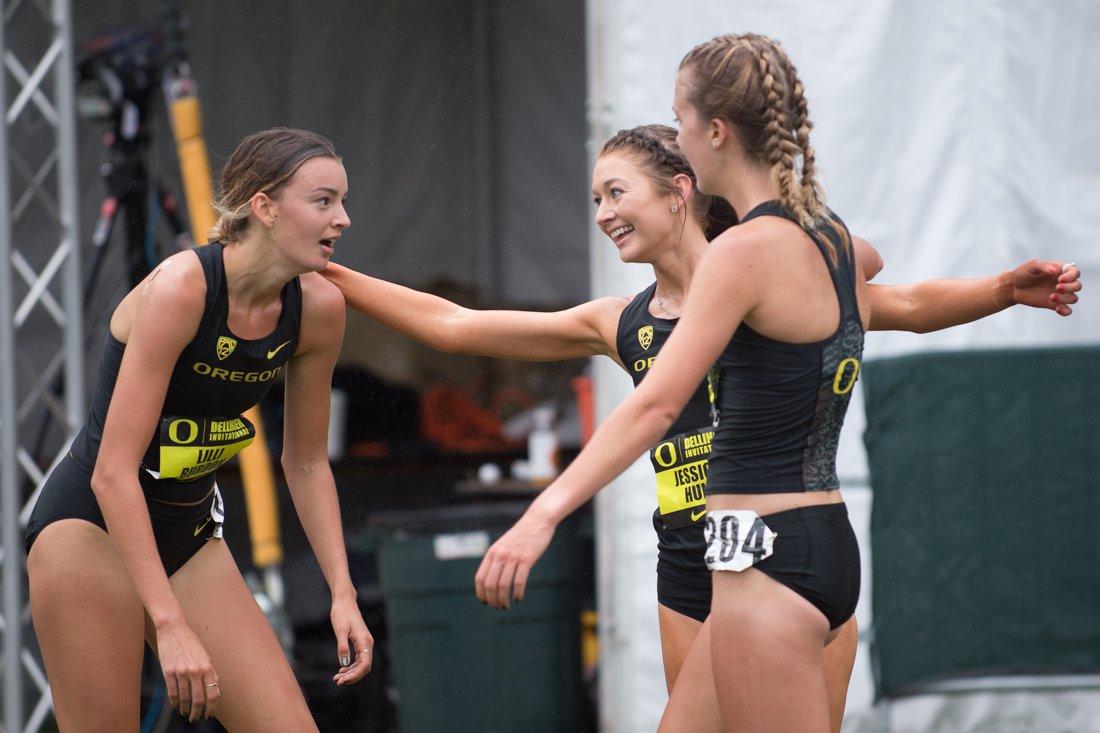 Oregon sophomore Lillie Burdon (left), Oregon junior Jessica Hull (center) and Oregon sophomores Katie Rainsberger greet each other in the finish chute. The University of Oregon hosts the 12th annual Bill Dellinger Invitational meet at the Springfield Golf Club in Marcola, Ore. on Friday, Sept. 29, 2017. (Adam Eberhardt/Emerald)