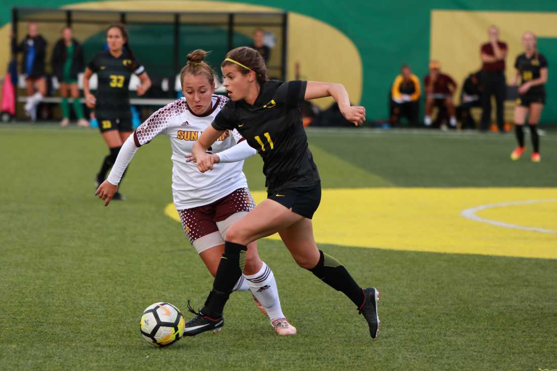 Oregon midfielder Nicole Seaman (11) pushes through Sun Devil midfielder Lara Barbieri (6) toward the goal. The Oregon Ducks play the Arizona State Sun Devils on October 13, 2017 at Pap&#233; Field in Eugene, Oregon. (Kiara Green/Emerald)