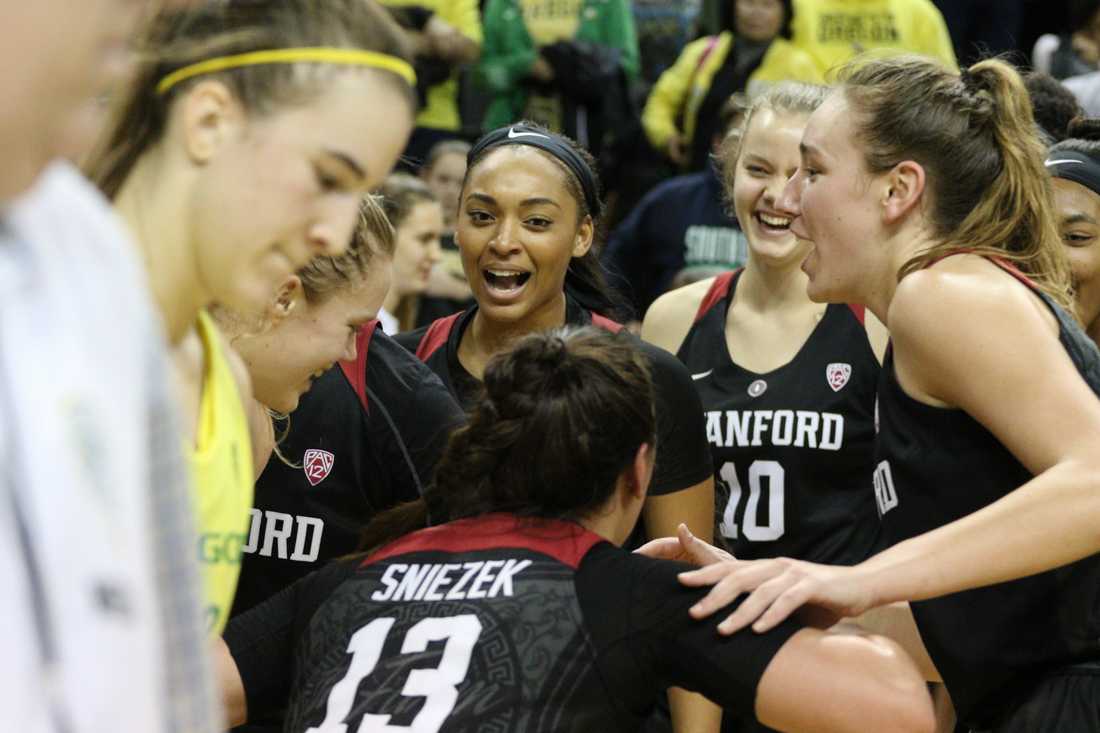 The Stanford Cardinals celebrate their win over the Oregon Ducks. Oregon basketball take on the Stanford Cardinals at Matthew Knight Arena in Eugene, Ore. on Feb. 4, 2018. (Devin Roux/Emerald)