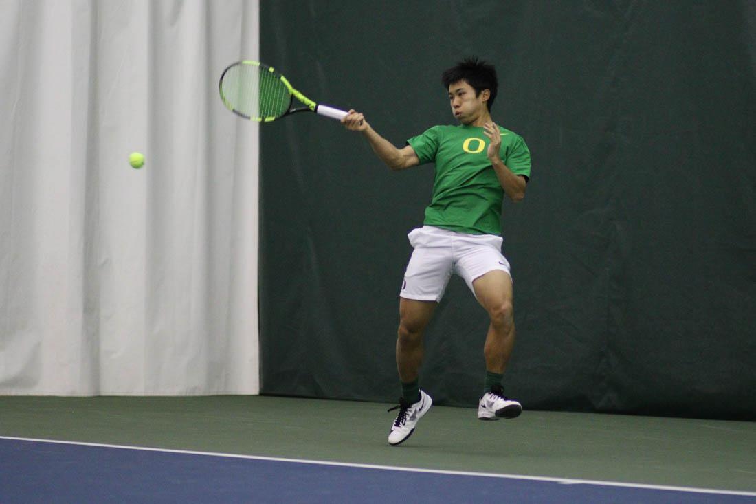 Oregon Ducks Akihiro Tanaka jumps to return the ball during his singles match. The Oregon Ducks face the Northern Arizona University Lumberjacks at the Oregon Student Tennis Center in Eugene, Ore. on Feb. 24, 2018. (Devin Roux/Emerald)