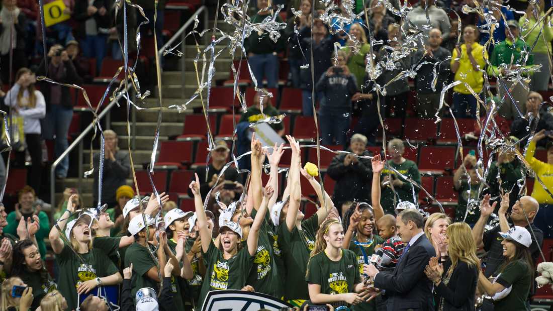 The Oregon Ducks celebrate their win on the podium. The Oregon Ducks face the Stanford Cardinal in the final of the Pac-12 Tournament at KeyArena in Seattle, Wash. on Sunday, March 4, 2018. (Adam Eberhardt/Emerald)