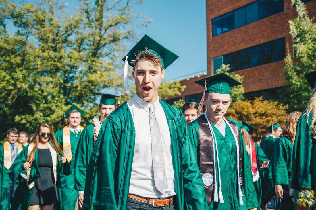 The University of Oregon celebrates its 142nd commencement with the traditional Thirteenth Avenue Duck Grad Parade on June 18, 2018. (Sarah Northrop/Emerald)