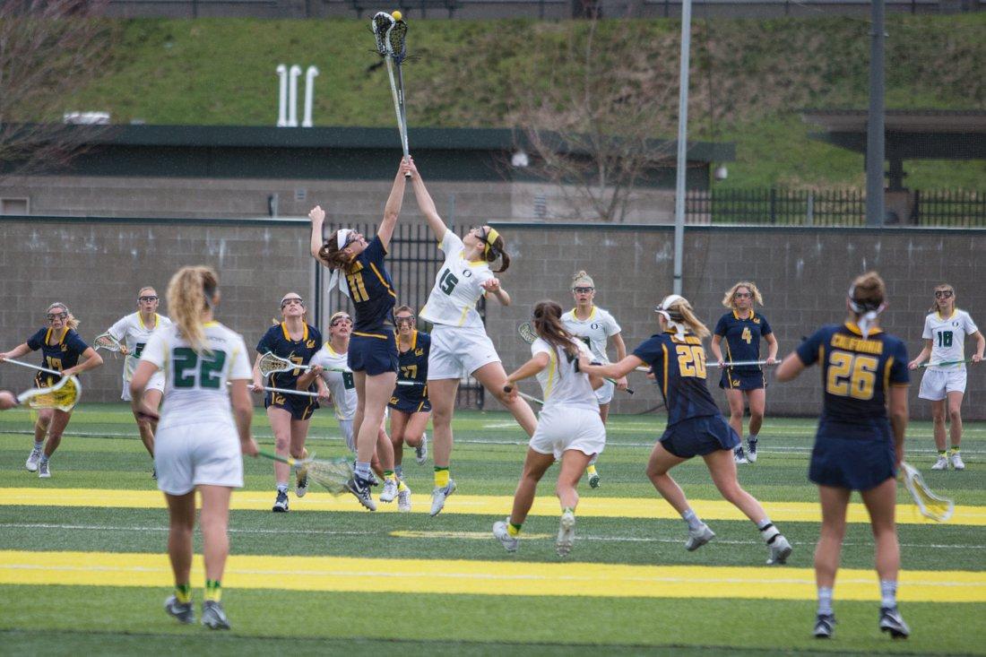 Oregon lacrosse battles for the ball against Cal. (Emerald Archives)