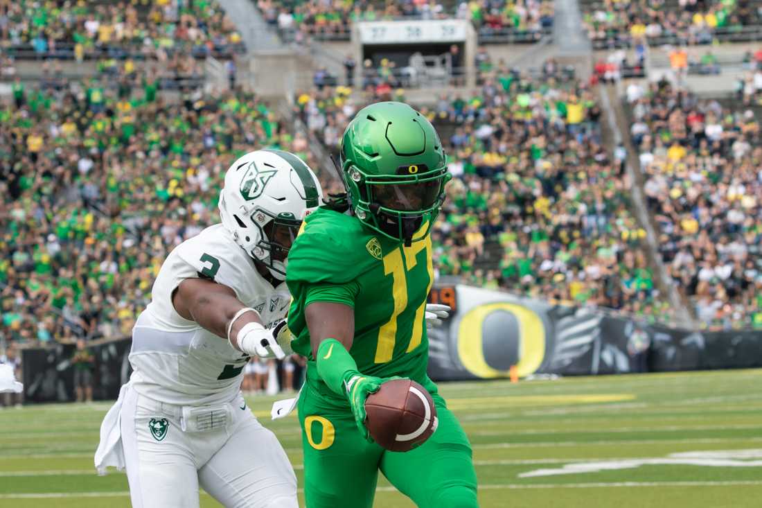 <p>Ducks wide reciever Tabari Hines (17) reaches the ball into the end zone, scoring a touchdown. Oregon Ducks Football takes on Portland State at Autzen Stadium on Sept. 8, 2018. (Sarah Northrop/Emerald)</p>