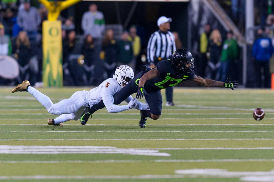 Ducks wide reciever Dillon Mitchell (13) desperately reaches for the falling ball. Oregon Ducks football takes on Arizona State at Autzen Stadium in Eugene Ore. on Nov. 17, 2018. (Ben Green/Emerald)