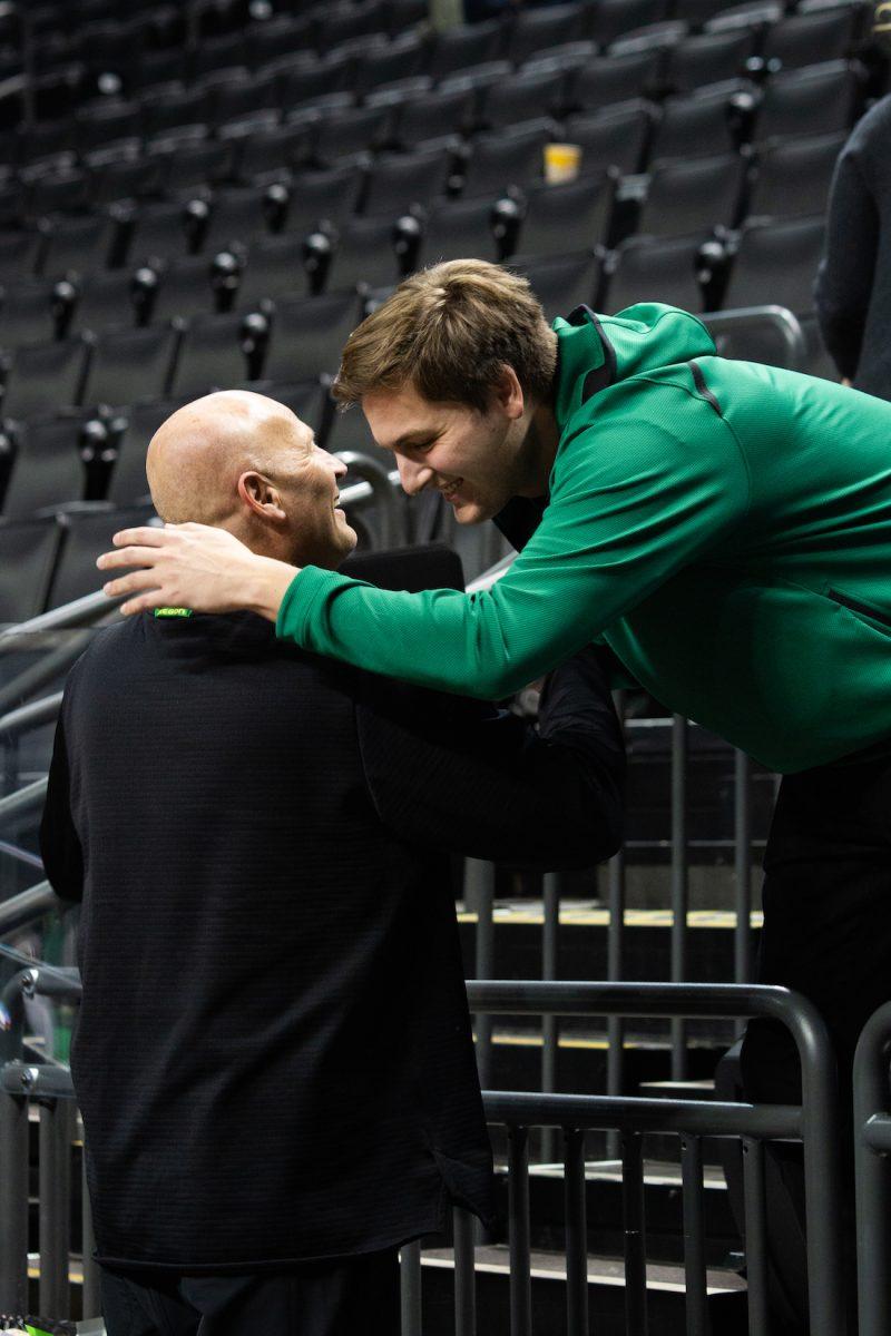 Ducks womens basketball head coach Kelly Graves and his son Max greet each other after the game against University of Washington on Jan. 4, 2019. (Sarah Northrop/Emerald)