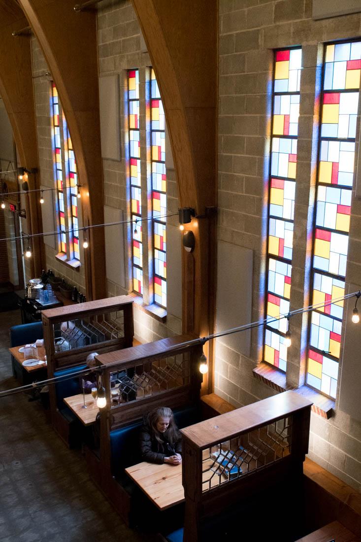 Customers sit and enjoy the atmosphere of Public House. Public House offers beers and drinks, as well as a variety of food vendors, in Springfield, Ore. March 8, 2019. (Madi Mather/Emerald)