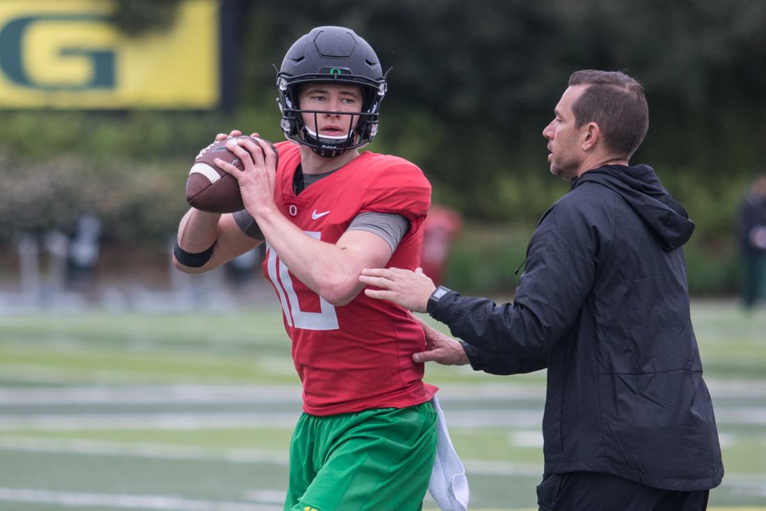 Oregon Ducks quarterback Justin Herbert (10) runs a footwork drill with co-offensive coordinator and quarterbacks coach Marcus Arroyo. The Oregon Ducks hold practice during their spring season at the Hatfield-Dowlin Complex practice fields in Eugene, Ore. on Monday, April 17, 2017. (Aaron Nelson/Emerald)