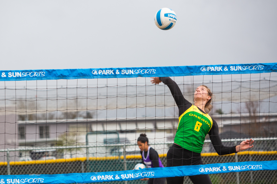 Carly Wallace (8) hits the ball over the net. Oregon Ducks beach volleyball takes on the Portland Pilots at Amazon Park in Eugene, Ore. on April 6, 2019. (Sarah Northrop/Emerald)