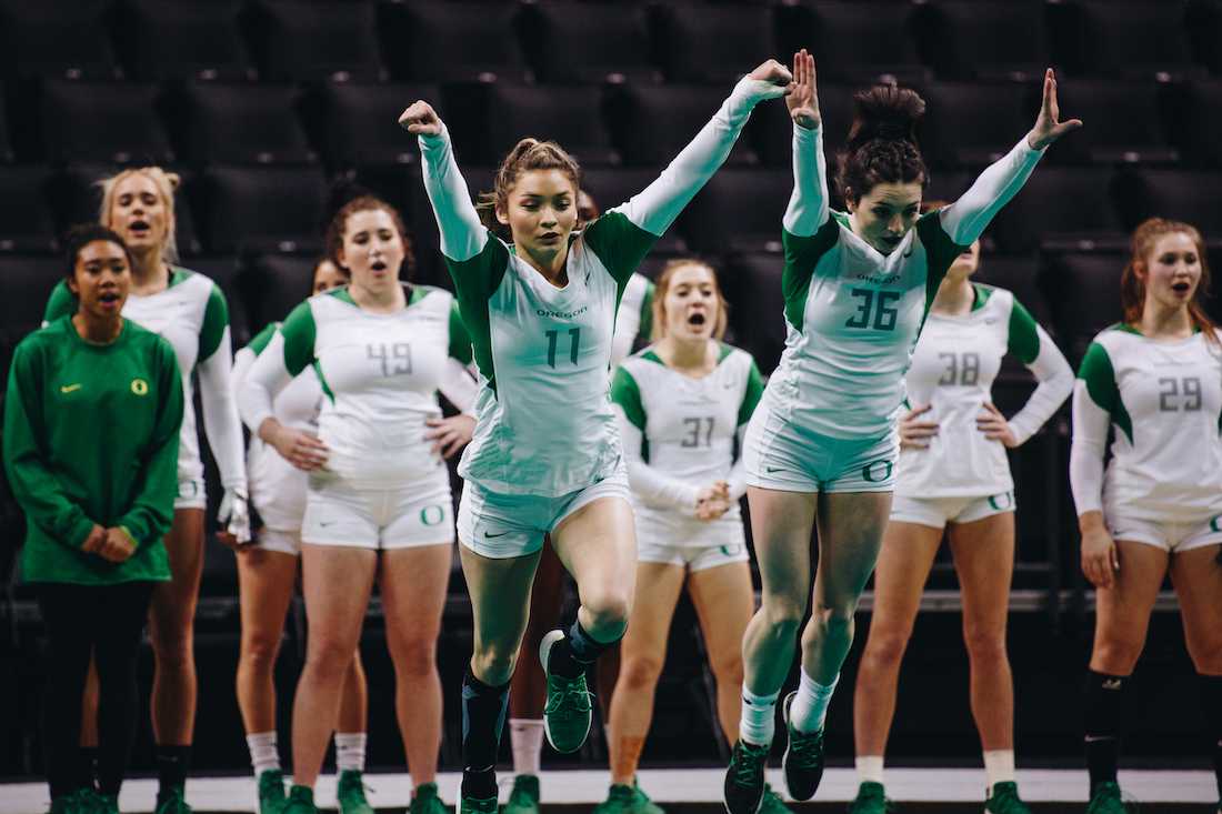 Ducks tumblers Casi Jackson (11) and Makenna Jarman (36) practice on the mat. Oregon acrobatics and tumbling holds a mock meet at Matthew Knight Arena in Eugene, Ore. on Jan. 29, 2019. (Sarah Northrop/Emerald)