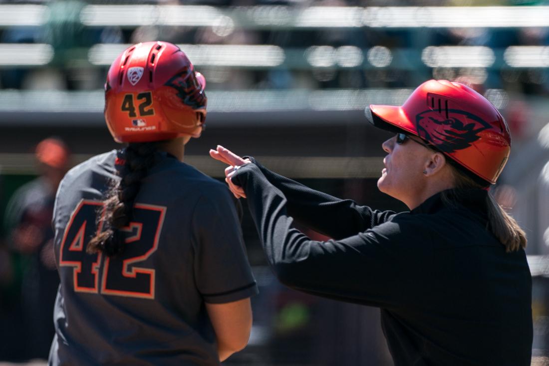 Infielder Frankie Hammoude (42) recieves instructions on third base. Oregon Ducks softball takes on Oregon State University at Jane Sanders Stadium in Eugene, Ore. on April 26, 2019. (Ben Green/Emerald)