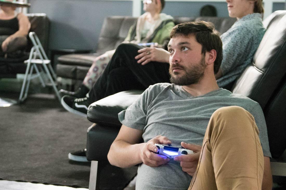 Kenny Gangle plays a video games with the other kids at the drop-in center. Youth Era works with youth in Eugene, Ore. at its drop-in center, providing a space for studying, gaming, socializing and more. April 30, 2019. (Madi Mather/Emerald)