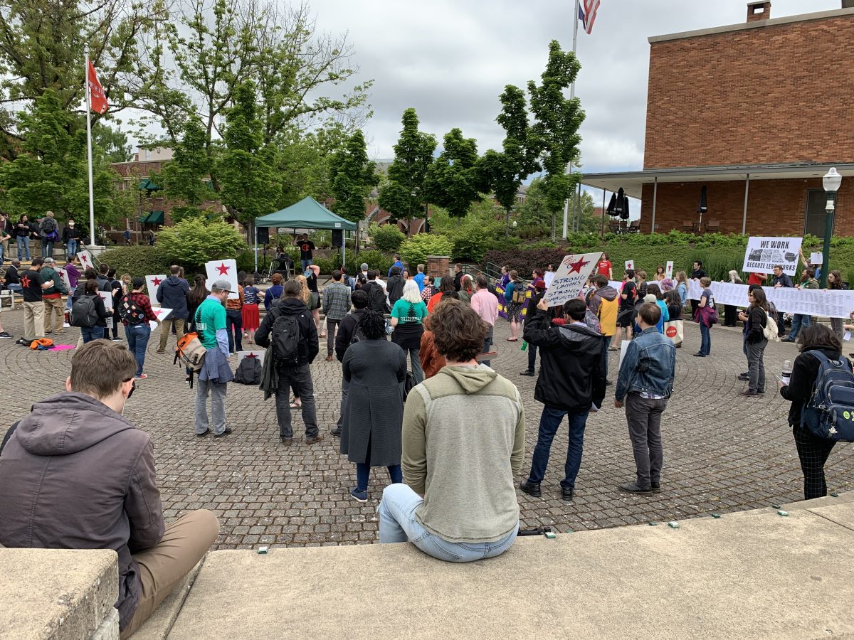 Protesters rally in the EMU Amphitheater May 23 after the Board of Trustees meeting on behalf of the GTFF, LERC and other labor unions who face budget cuts or a contract negotiation standstill. (Becca Robbins/Emerald Archives)