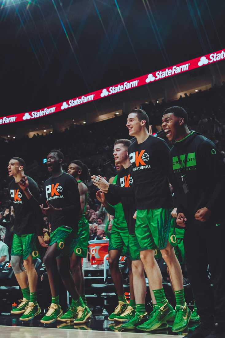 After a series of fouls called on Oregon, the Oregon bench cheers when Memphis gets a penalty. Oregon Ducks men's basketball takes on the Memphis Tigers as part of the Phil Knight Invitational at the Moda Center in Portland, Ore. on Nov. 12, 2019. (Sarah Northrop/Emerald)