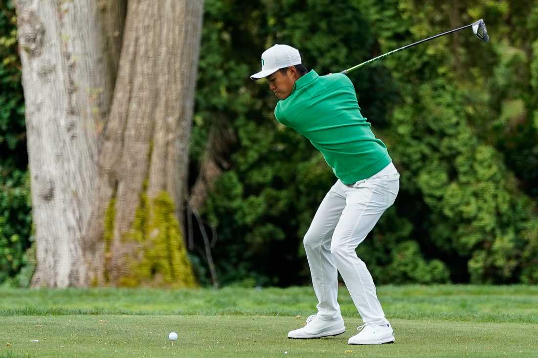 Freshman Yin Ho Yue hits the ball. Oregon Ducks men's golf plays in the Pac-12 Championships at Eugene Country Club in Eugene, Ore. on April 24, 2019. (Ben Green/Emerald)