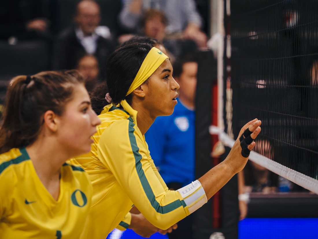 <p>Ducks middle blocker Ronika Stone (7) lines up at the net. Oregon Ducks Volleyball takes on Arizona State University at Mathew Knight Arena in Eugene, Ore. on November 17, 2019. (Connor Cox/Emerald)</p>