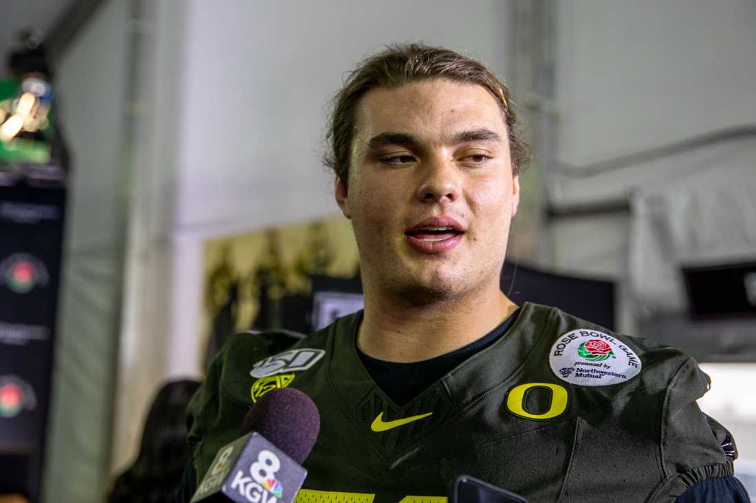 Oregon Ducks offensive lineman Shane Lemieux (68) speaks about the upcoming Rose Bowl game. (Maddie Knight/Emerald)