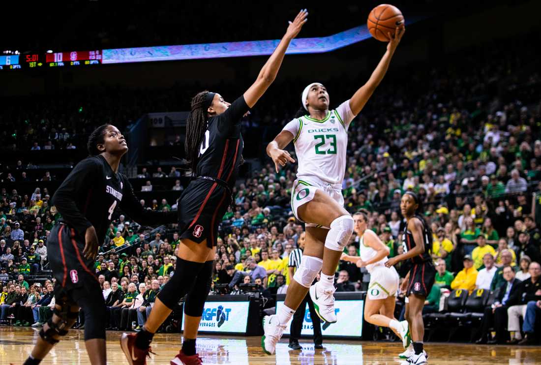 <p>Ducks guard Minyon Moore (23) makes a lay up. Oregon Ducks women's basketball takes on Stanford at Matthew Knight Arena in Eugene, Ore. on Jan. 16, 2020. (Kimberly Harris/Emerald)</p>