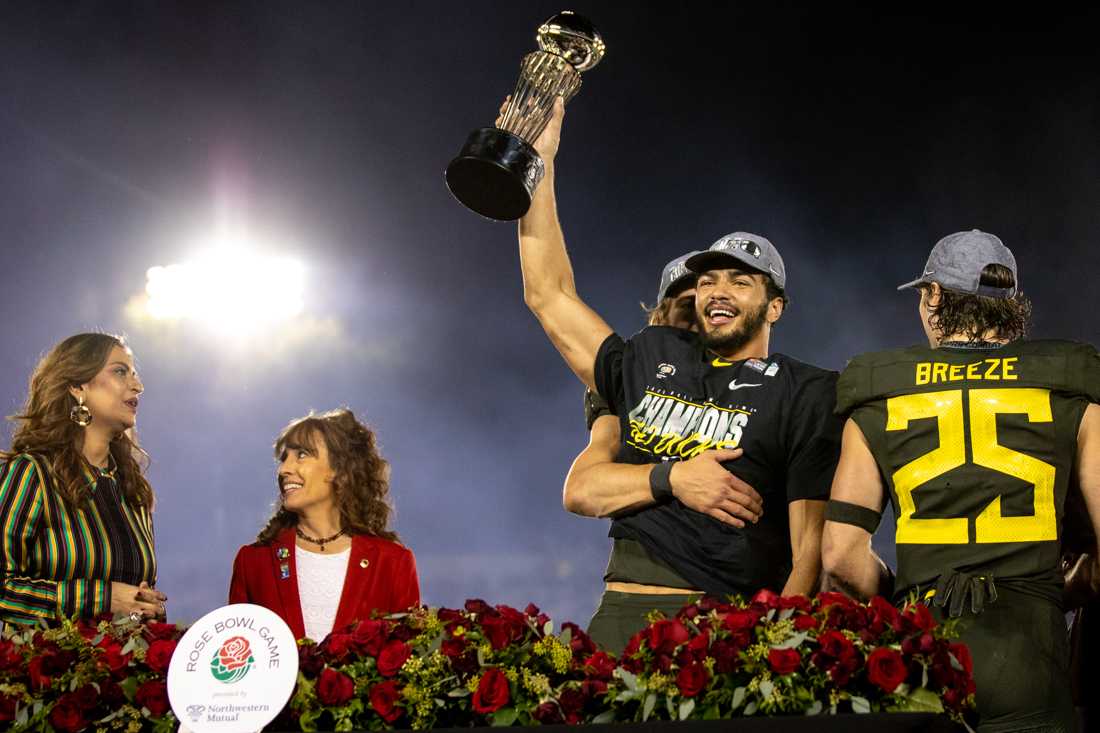 Ducks celebrate after their win. Oregon Ducks football takes on Wisconsin for the 106th Rose Bowl Game at Rose Bowl Stadium in Pasadena, Calif. on Jan. 1, 2020. (Maddie Knight/Emerald)