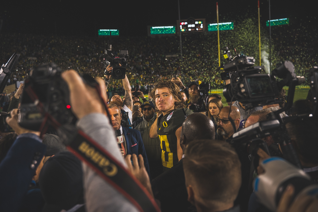 Ducks quarterback Justin Herbert (10) looks up, taking a breather before being interviewed. Oregon Ducks football takes on Wisconsin for the 106th Rose Bowl Game at Rose Bowl Stadium in Pasadena, Calif. on Jan. 1, 2020. (DL Young/Emerald)