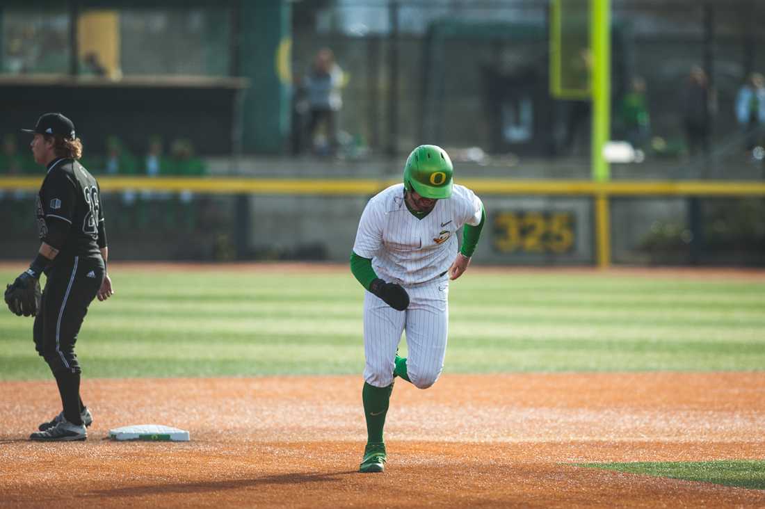 Ducks designated hitter Kenyon Yovan (21) begins a run from second. Oregon Ducks baseball takes on the Nevada Wolf Pack at PK Park in Eugene, Ore. on Feb. 22, 2020. (DL Young/ Emerald)