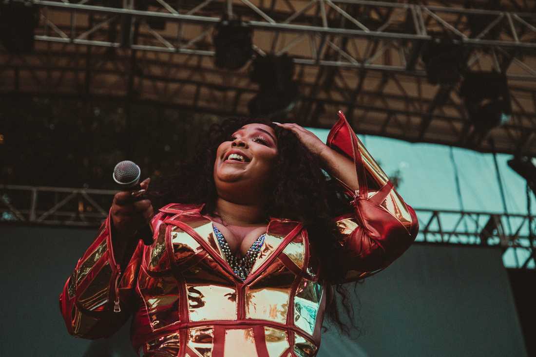 Lizzo holds her lipstick-stained mic out to the crowd. Lizzo performs two nights of 'Cuz I Love You Too' as part of the Edgefield Concerts on the Lawn series in Troutdale, Ore. on July 18, 2019. (Sarah Northrop)