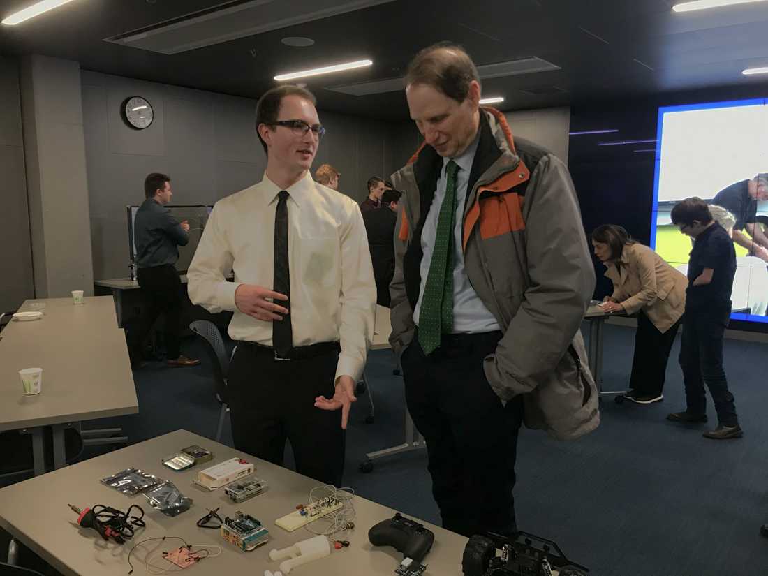 UO BIO Club Vice President Myles Nelson shows Senator Ron Wyden some of the club's other projects during the senator's visit to campus Tuesday, Feb. 18. (Anna Mattson/Emerald)