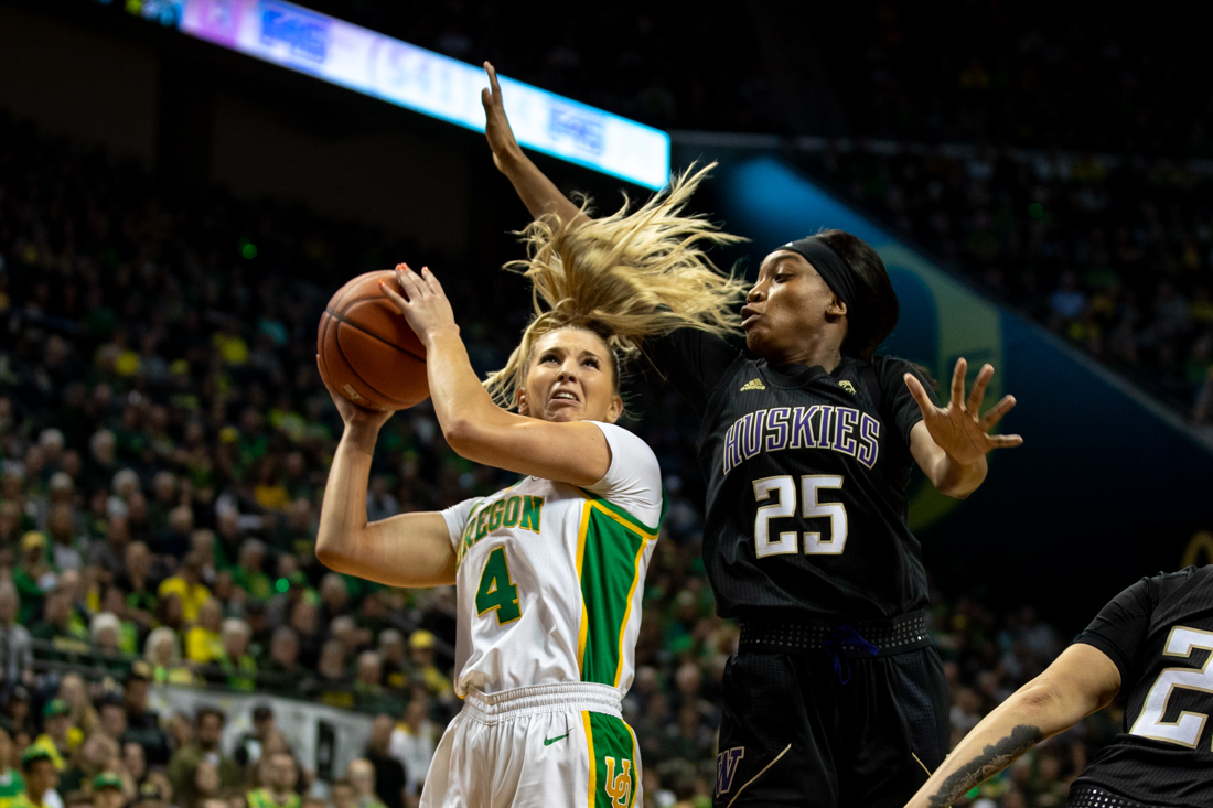 Oregon Ducks guard Jaz Shelley shoots the ball past the other team. Oregon Ducks women&#8217;s basketball takes on University of Washington at the Matthew Knight Arena in Eugene, Ore. on Mar 1, 2020. (Maddie Knight/Emerald)