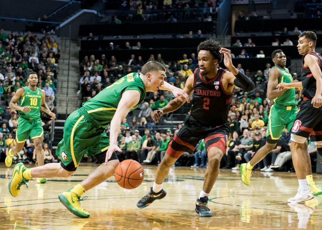 Peyton Pritchard (3), guard for the Ducks, pushes past the Stanford defense. Oregon Ducks men's basketball takes on Stanford at Matthew Knight Arena in Eugene, Ore. on Mar. 7, 2020. (Madi Mather/Emerald)