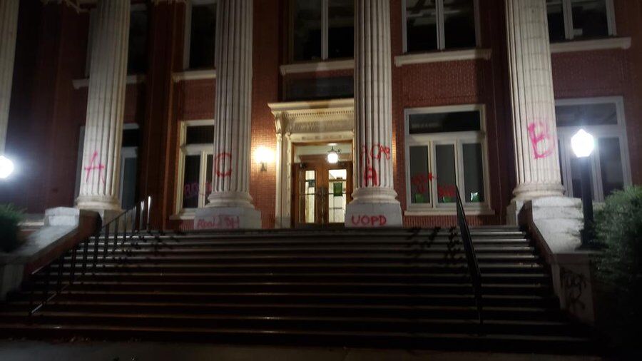 Protesters made their way to campus where they graffitied 'ACAB,' 'Disarm UOPD' and 'Fuck Schill' on the front of Johnson Hall.&#160;