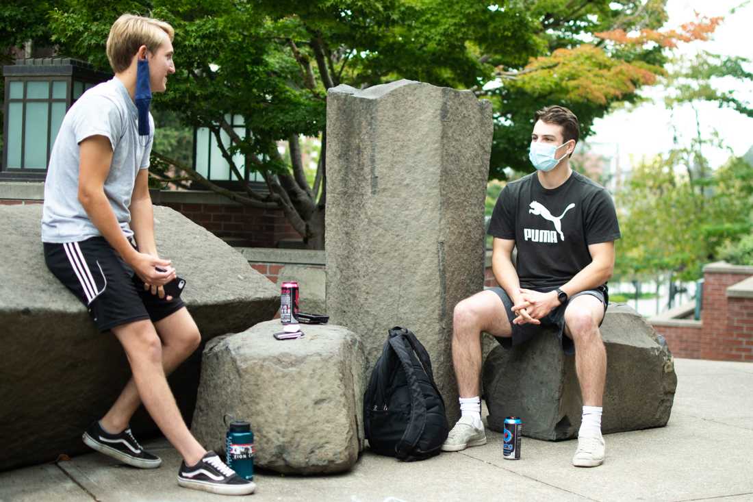 <p>Jack Hardley (left) and Grant Leiphart, seniors at UO, chat and prepare for their work out outside of the Rec. Center. 