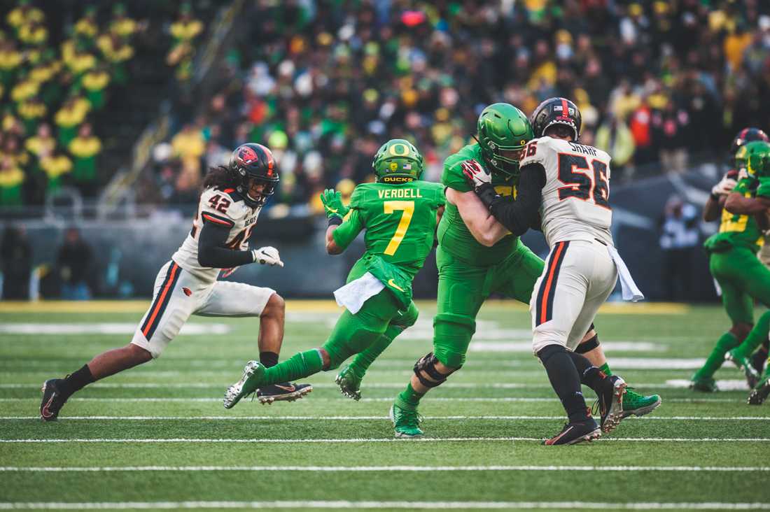 Ducks running back CJ Verdell (7) jukes out a defending Beaver. Oregon Ducks football takes on Oregon State for the Civil War game at Autzen Stadium in Eugene, Ore. on Nov. 30, 2019. (DL Young/Emerald)