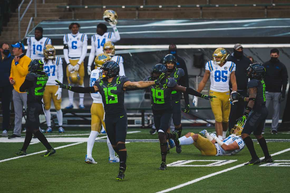 Ducks safeties Bennett Williams (15) and Jamal Hill (19) celebrate an incomplete pass. Oregon Ducks football takes on the UCLA Bruins at Autzen Stadium in Eugene, Ore., on Nov. 21, 2020. (DL Young/Emerald)