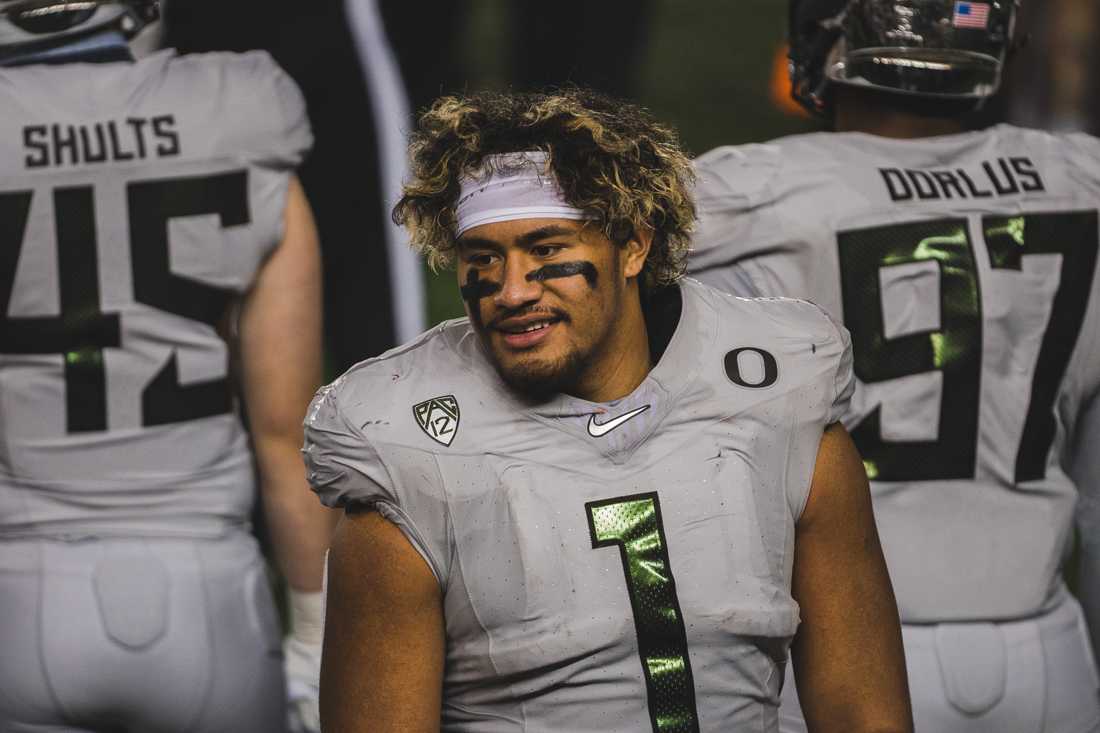 Ducks innside linebacker Noah Sewell (1) talks to his teammates on the sidelines. Oregon Ducks football takes on the California Golden Bears at California Memorial Stadium in Berkeley, Calif., on Dec. 5, 2020. (DL Young/Emerald)