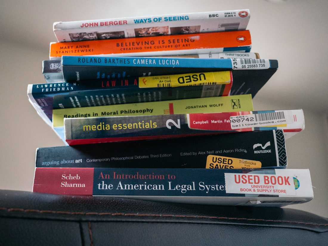 A stack of college textbooks. (Connor Cox/Emerald)