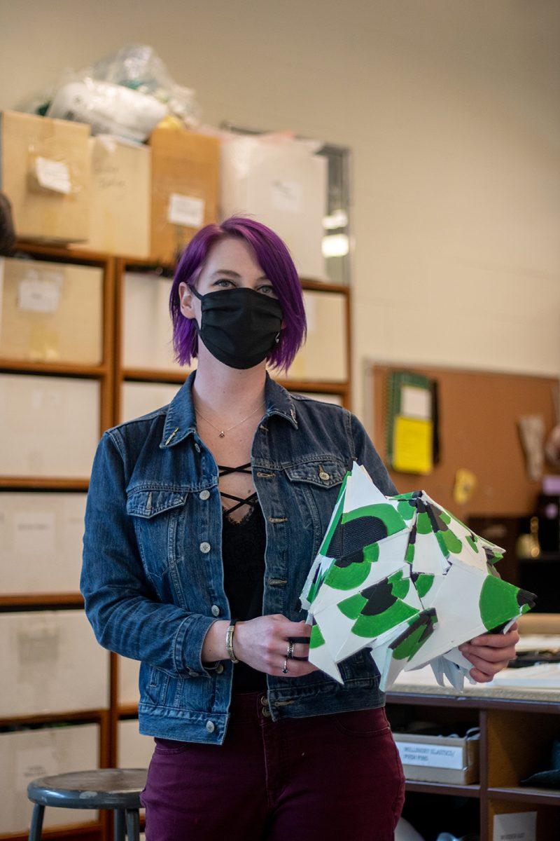 Ashley Baker poses with a portion of a costume she designed, "Fragmented", for the new presentation "Personal Game" at the University of Oregon.The University of Oregon's Theater program is showing a new presentation entitled "Personal Game". (Will Geschke/Emerald)