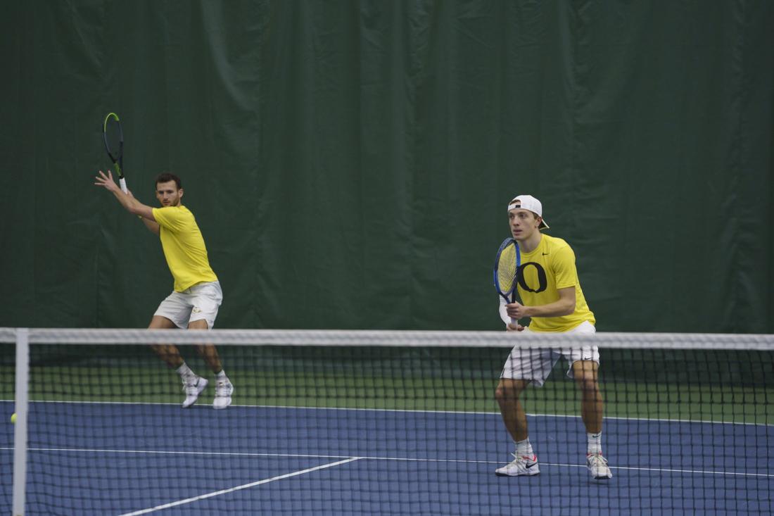 Ducks duo&#8217;s Emmanuel Coste and Jesper Klov-Nilsson prepares to hit the ball. Oregon Ducks men&#8217;s tennis takes on Portland State University at the Student Tennis Center on Feb. 08, 2021. (Kevin Wang/Daily Emerald)