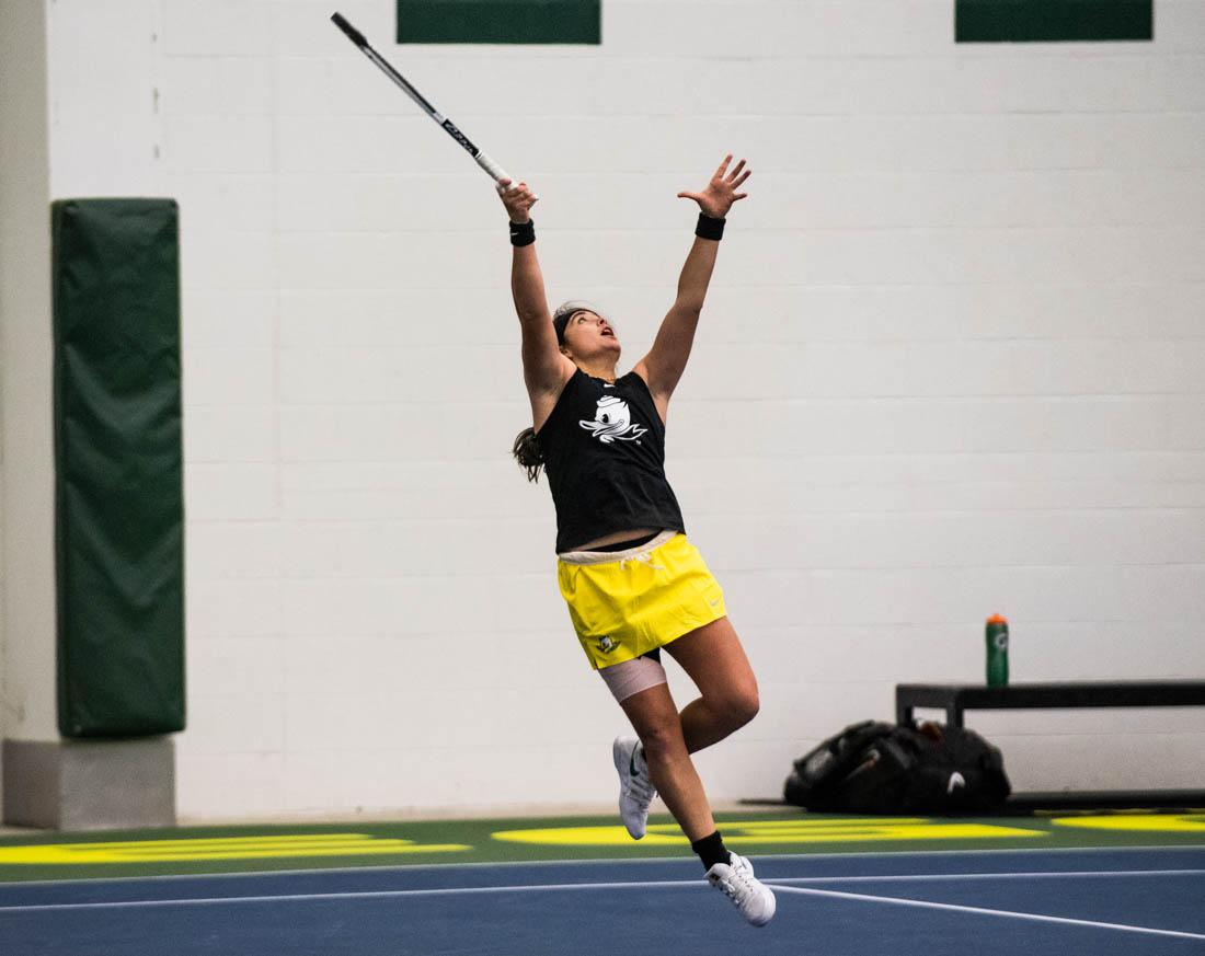 Oregon&#8217;s Uxia Martinez Moral jumps up to make contact with the ball. Oregon Ducks women&#8217;s tennis takes on the Utah Utes at the Oregon Student Tennis Center in Eugene, Ore., on March 14, 2021. (Ian Enger/Emerald)