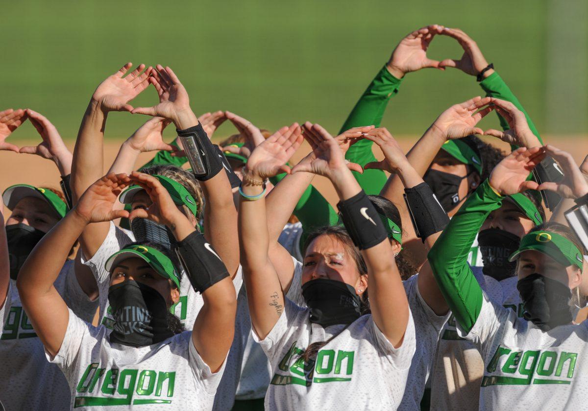 The Ducks throw their &#8220;O&#8221; at the end of the second game. Oregon Softball takes on Loyola Marymount University for a doubleheader at Jane Sanders Stadium in Eugene, Ore., on March 26, 2021. (Summer Surgent-Gough/Emerald)