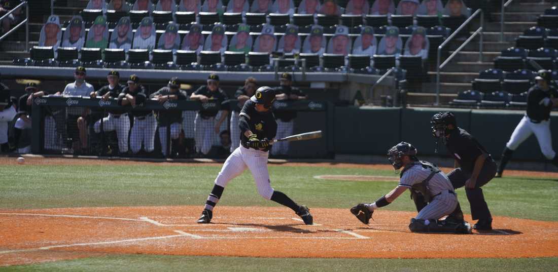 Ducks outfielder/third base Aaron Zavala (13) swings at a Pilot&#8217;s pitch. Oregon Ducks baseball takes on Portland Pilots at PK Park in Eugene, Ore., on April 6, 2021. (Kevin Wang/Daily Emerald)