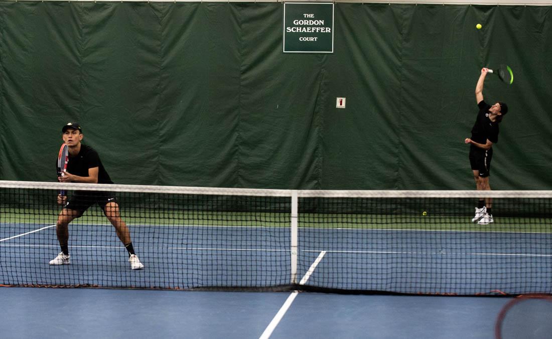 Ducks players Brandon Lam (left) and Luke Vandecasteele (right) face off against Cal Poly in a doubles match. Oregon Ducks men&#8217;s tennis takes on the Cal Poly Mustangs at the Oregon Student Tennis Center in Eugene, Ore., on March 7, 2021. (Ian Enger/Emerald)