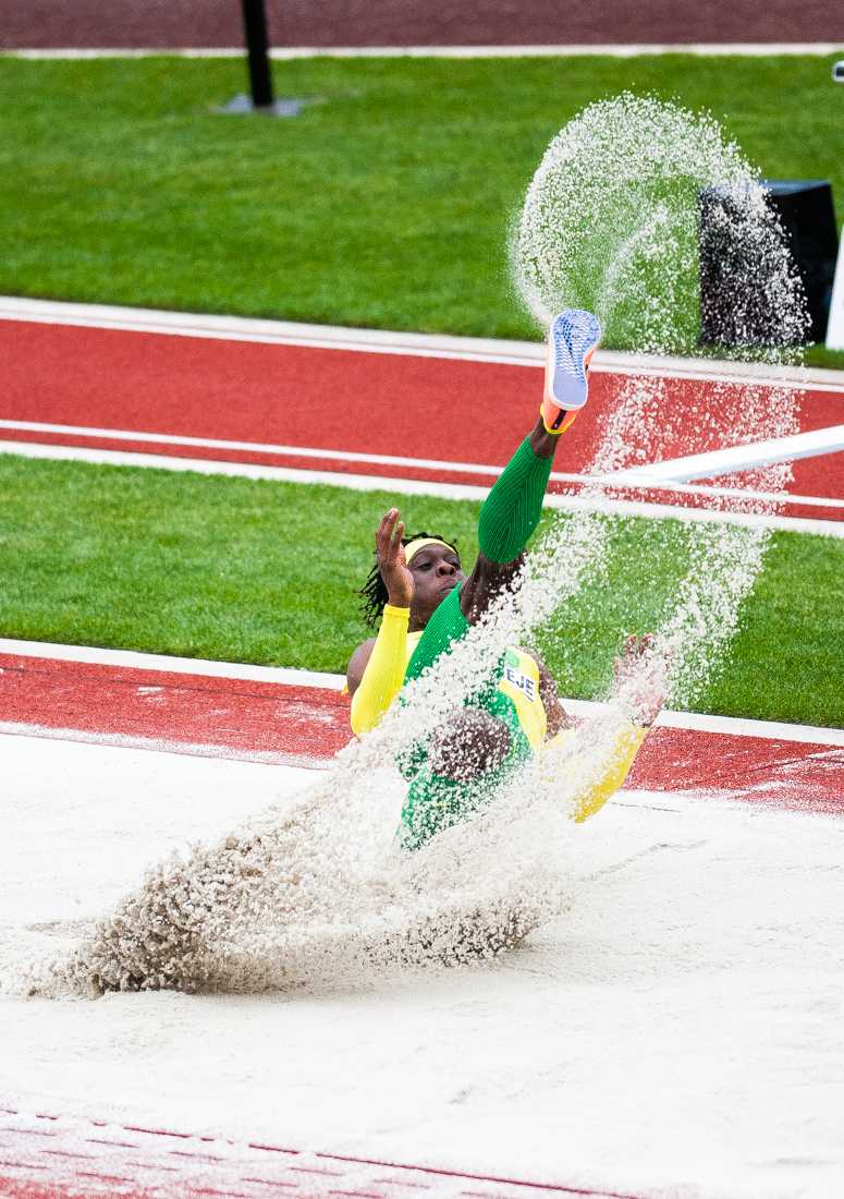 Oregon's Emmanuel Ihemeje kicks up sand as he lands during the men&#8217;s triple jump. Hayward Field hosts the third day of the 2021 NCAA Outdoor Track and Field Championships in Eugene, Ore., on June 11, 2021 (Ian Enger/Emerald).