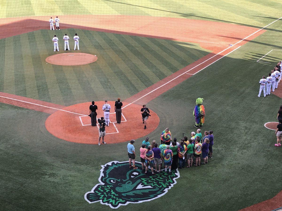 A choir sings pregame as the Emeralds take on the Vancouver Canadians while celebrating Pride Night.