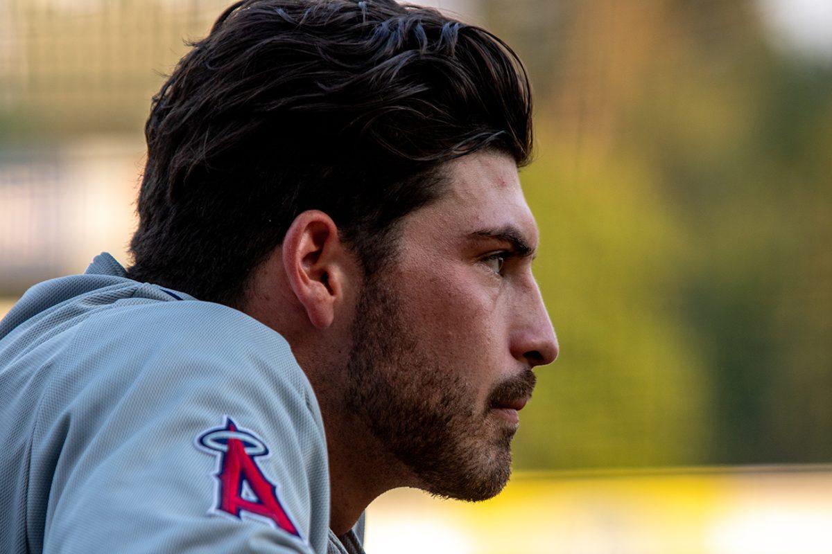 Kenyon Yovan, a former player for the University of Oregon, looks out of the Dust Devils dugout. The Eugene Emeralds, who played under their alternate name Monarcas de Eugene, defeated the Tri-City Dust Devils 11-4 on Tuesday, August 3, at PK Park in Eugene, Oregon. (Will Geschke/Emerald)