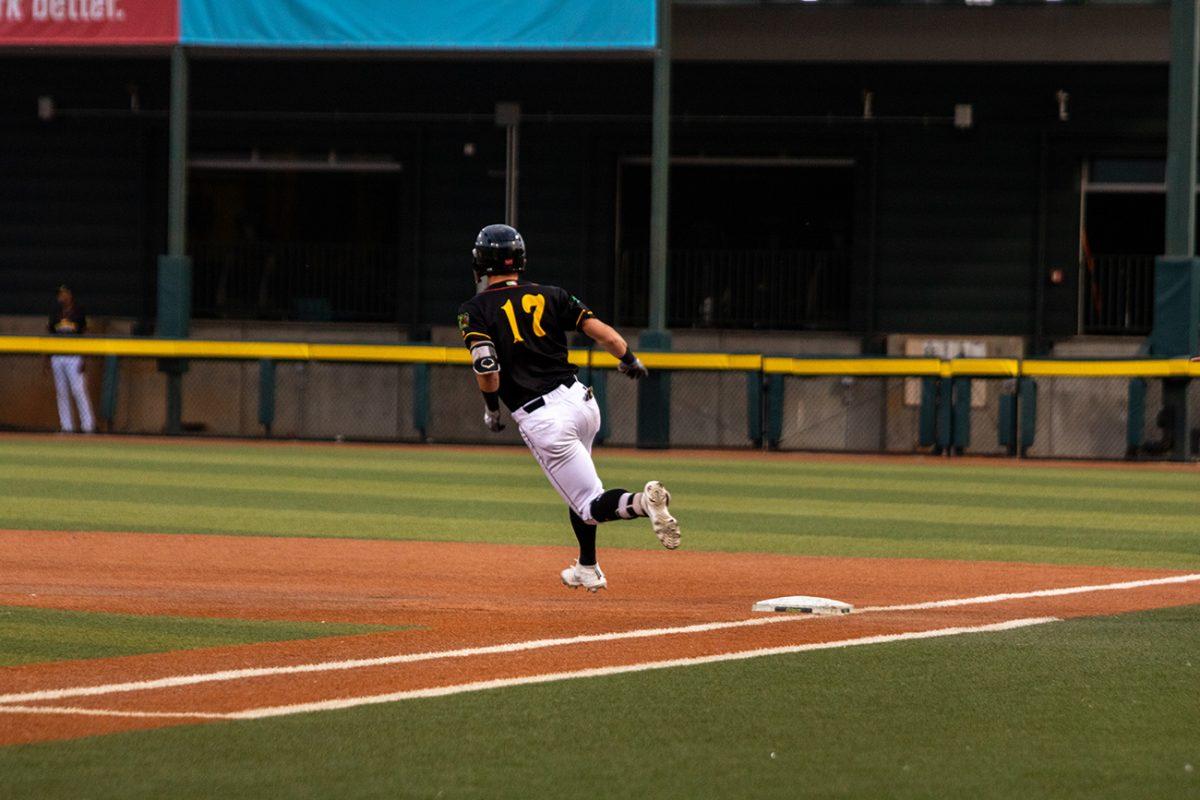 Tyler Fitzgerald (17) flies towards second base. The Eugene Emeralds, who played under their alternate name Monarcas de Eugene, defeated the Tri-City Dust Devils 11-4 on Tuesday, August 3, at PK Park in Eugene, Oregon. (Will Geschke/Emerald)