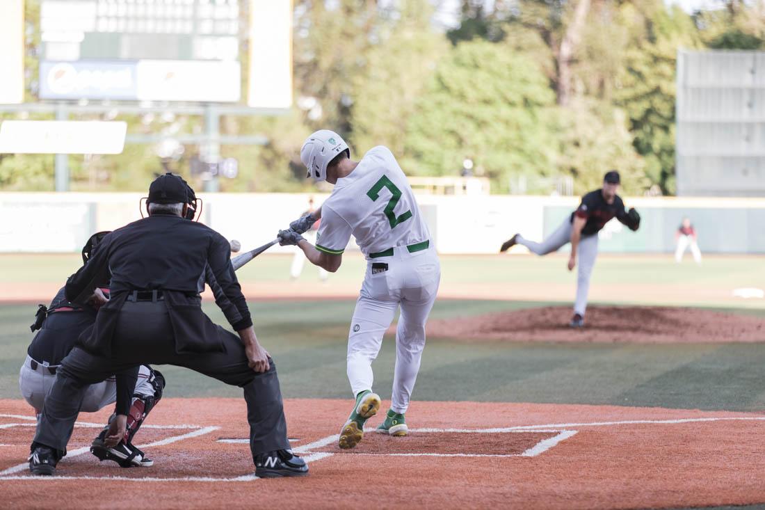 Ducks Catcher Jack Scanlon (2) makes contact with the ball while batting. Ducks Baseball take on Stanford Cardinal at PK Park in Eugene, Ore., on May 21, 2021 (Maddie Stellingwerf/Emerald)