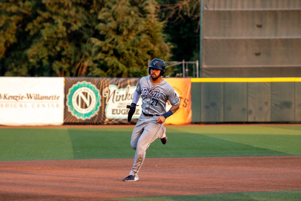 Francisco Del Valle (27) runs towards third base. The Eugene Emeralds, who played under their alternate name Monarcas de Eugene, defeated the Tri-City Dust Devils 11-4 on Tuesday, August 3, at PK Park in Eugene, Oregon. (Will Geschke/Emerald)