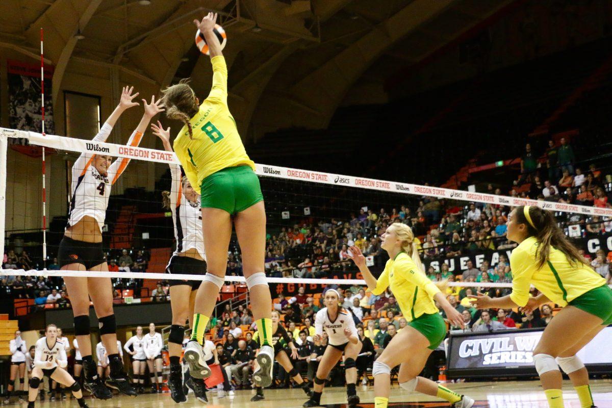 Lindsey Vander Weide (#8) spikes the ball during the final set of the Civil War Volleyball game on September 24, 2015 at Gill Coliseum. In the first Civil War of the season, the Ducks beat the Beavers 3-1 to improve to 7-3 on the year in Corvallis Oregon on September 24th, 2015.(Samuel Marshall/Emerald)